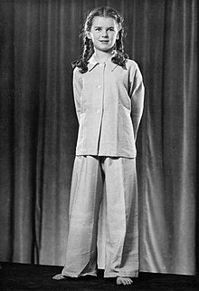 old photo of British girl wearing a pyjamas set